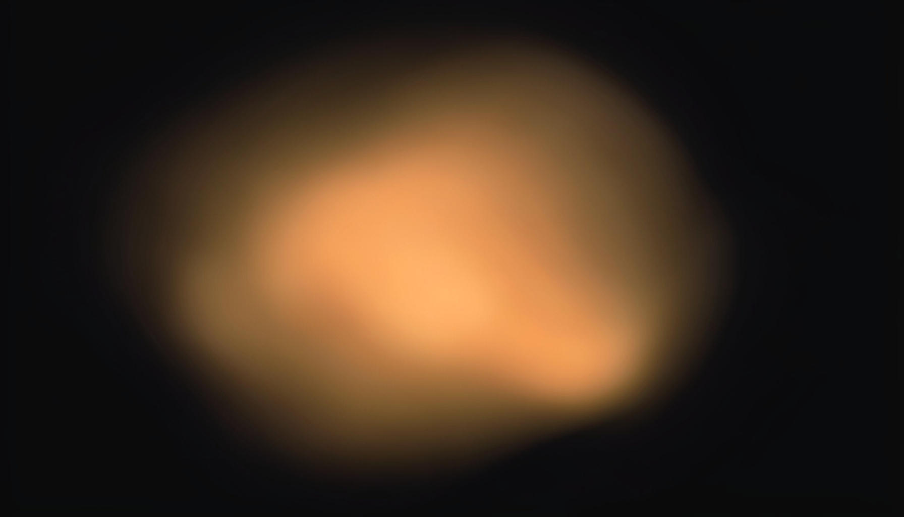 Charcoal background with a single warm gold glow, abstract and uncluttered.